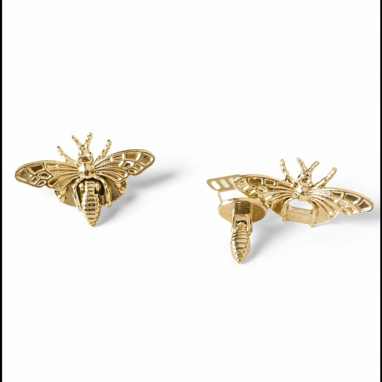 metalowe zapięcie do torebki złota mucha.png